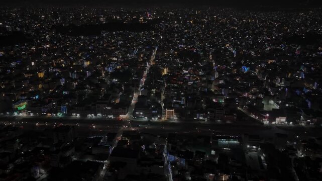 Aerial night footage of Kathmandu city during Diwali (Tihar), featuring the illuminated Dharahara Tower and glowing skyline filled with festive lights, showing Nepal&rsquo;s vibrant cultural celebration.