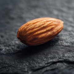 Single Almond Macro on Dark Slate — Detailed Texture Food Still Life