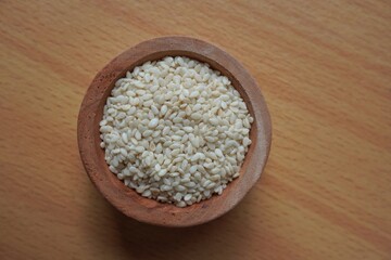 Sesame seeds in the wooden bowl