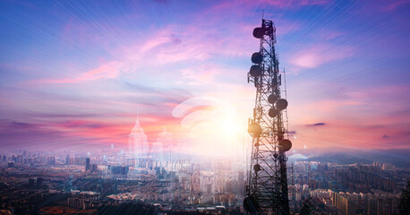 Telecommunication tower with cityscape background at sunset,panoramic view