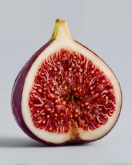 Fresh Fig Half Macro on Light Gray — Vivid Seeds and Flesh, Studio Still Life