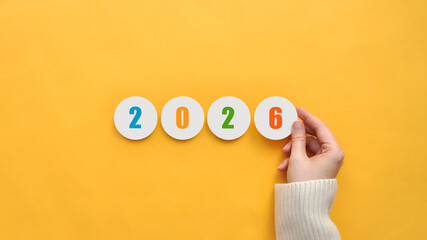 2026 - numbers on paper stickers. The arrival of the new year 2026, the concept of a holiday