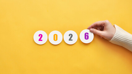 2026 - numbers on paper stickers. The arrival of the new year 2026, the concept of a holiday