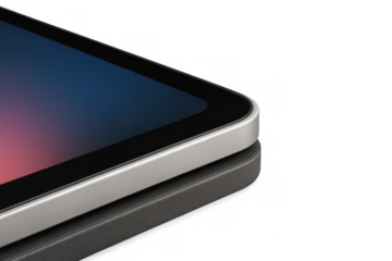 Tablet device resting on a reflective surface, displaying a vibrant screen with a blend of blue and pink hues