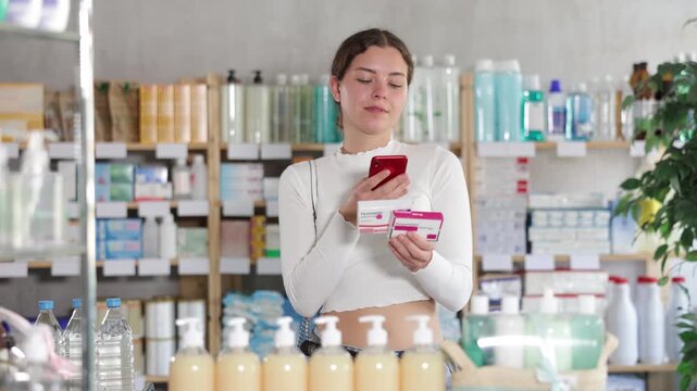 Gierl scans code on package of paracetamol pills to check the expiration date. High quality 4k footage