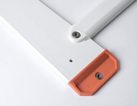 Close-up of white wooden structure with orange corner detail