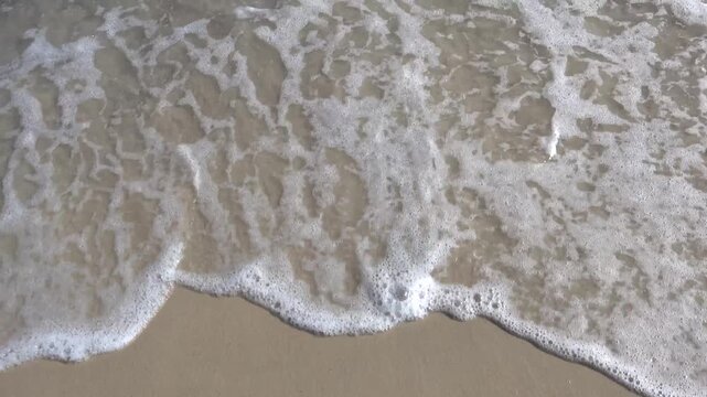 Sousse, Tunisia Light surf and waves rolling onto the sandy beach. 