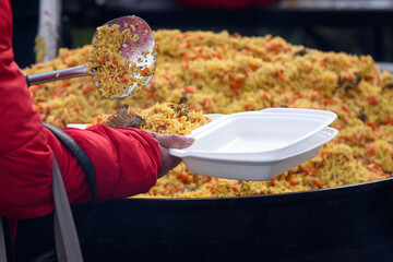Serving Uzbek Plov in Disposable Container ? Street Food and Community