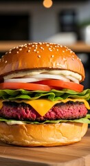 Close-up of a delicious hamburger with fresh vegetables, melted cheese, and a juicy patty in a sesame seed bun on a wooden surface in a cozy restaurant setting