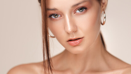 Naklejka premium Woman With Nude Glossy Lips And Perfect Skin In Skincare Beauty Ad