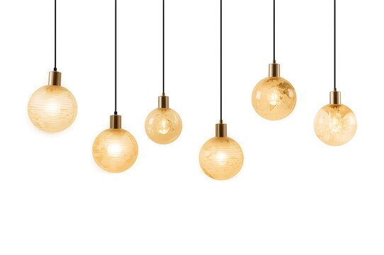 Cluster of glowing edison filament light bulbs hanging against a white background
