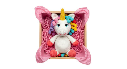 Crochet unicorn plushie nestled in pink