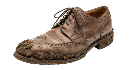 Mudcaked brown leather shoe worn