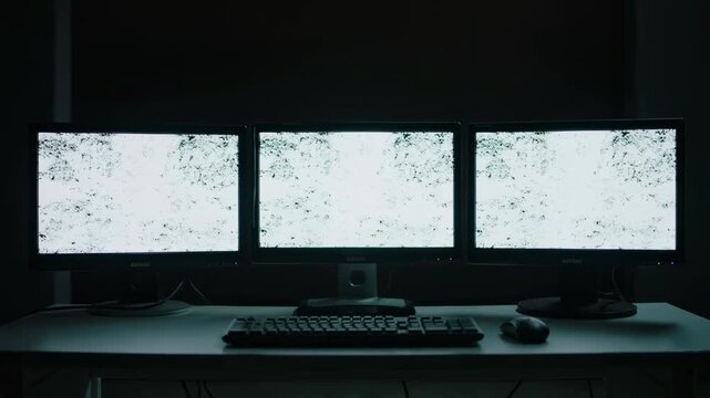 3 screen monitors with abstract static giving off scary horror movie vibes with dark ominous background