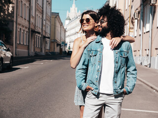 Smiling beautiful woman and her handsome boyfriend. Sexy cheerful family having tender moments in...