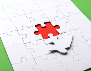 Close-up of a puzzle with missing piece, red background
