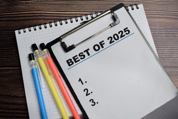 Concept of best of 2025 blank list write on clipboard isolated on Wooden Table.