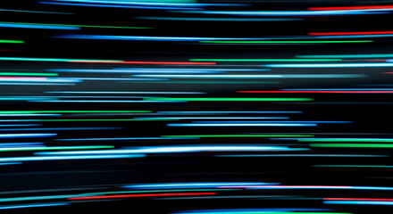 Abstract background of colorful neon light trails on black for concept of speed, technology, or motion