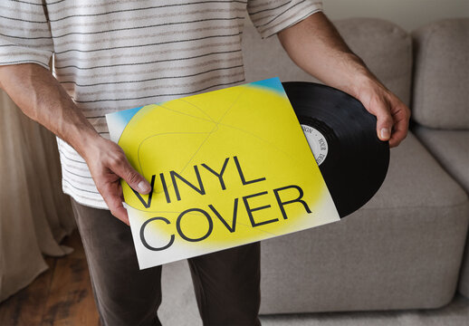 Mockup Of Man Holding Customized Record Cover