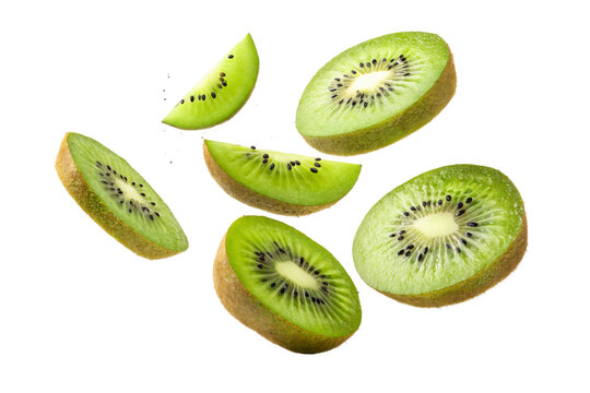Fresh kiwi slices falling with seeds against white - Powered by Adobe