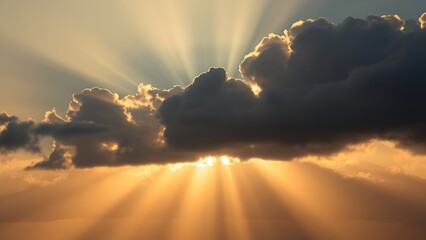 Fototapeta premium symbolic. The first rays of sunlight break through dark clouds at dawn over a landscape. travel magazines, destination branding, designed for outdoor magazines and nature guides.