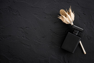 Black man perfume bottle top view. Male fragrance concept