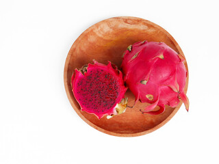 dragon fruit on wooden plate isolated on white background	