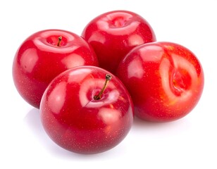Close-up of four glossy red plums against a white background