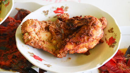 Ayam bakar Padang or Padang grilled chicken from West Sumatera. Cooked with more spices