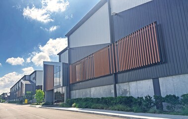 A modern warehouse unit complex with a side road