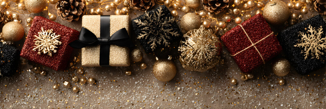 Christmas banner. Background Xmas design of sparkling lights garland, with realistic gifts box, black snowflake and glitter gold confetti. Horizontal christmas poster, greeting cards, headers, website - Powered by Adobe