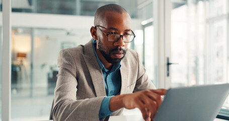 Office, reading and businessman with laptop, serious and financial analysis on web, online and point. Investment banker, black person and planning for pitch with tech, review and checking market