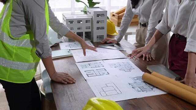 Engineering team discussing architectural building construction project