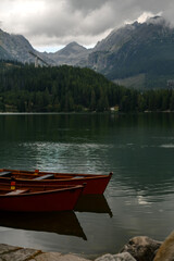 Obraz premium Red Boats on Mountain Lake