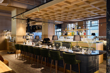 Elegant bar interior with stylish seating and drinks displayed
