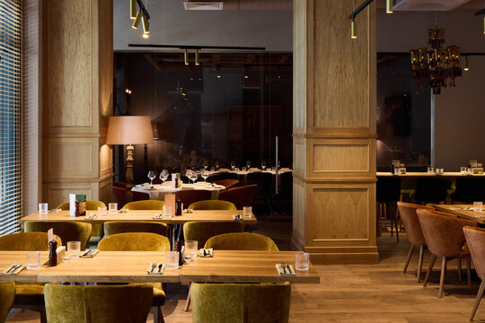 Elegant restaurant interior with warm lighting and wooden decor