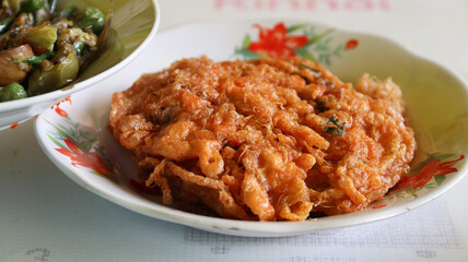 Talua Barendo or Minang Omelette or Telur Dadar Padang is Crispy Omelette Typically Food from Warung Nasi Padang. Usually Made with Add Some Flour.