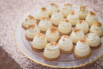 Mini Cheesecakes with Whipped Cream and Crumble Topping