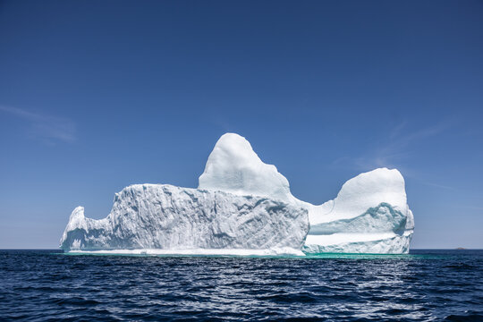 White Iceberg on Wavy Blue Water