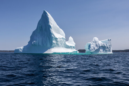 White Iceberg on Wavy Blue Water