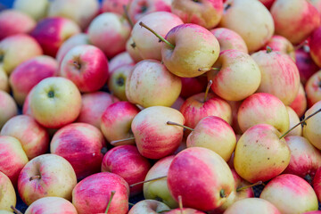Heap of vibrant fresh apples in market