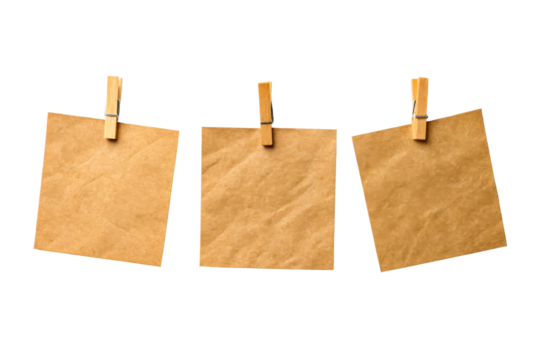 Three brown kraft paper notes on twine with clothespins