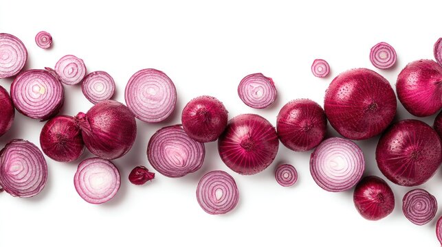 Overhead shot of sliced and whole red onions scattered on a bright white surface, creating a visually appealing display