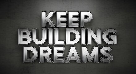A motivational sign with the phrase 'Keep Building Dreams' displayed in bold metallic letters on a dark background, inspiring perseverance and ambition