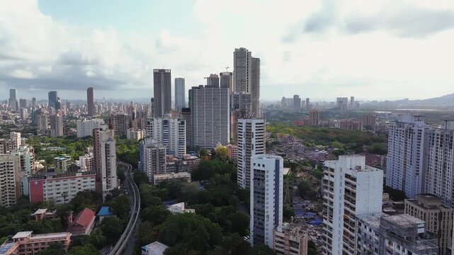 Aerial view of Mumbai city in Maharashtra, India. Beautiful cloudy weather during monsoon. Indian Cityscape