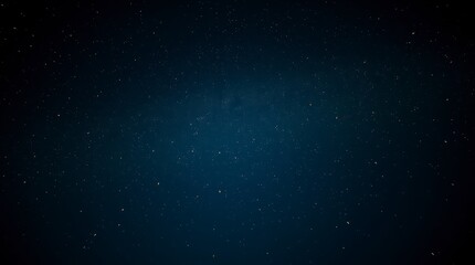 Obraz premium Starry night sky filled with twinkling stars over a calm landscape during late evening hours