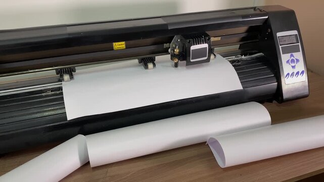 Paper plotter. Flatbed cutting plotter. Vinyl film. slow motion. High quality 4k footage