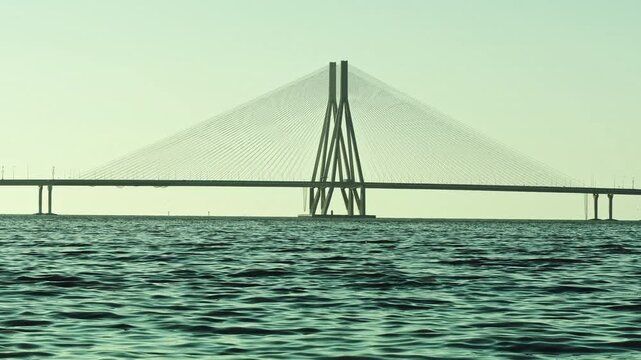 Cinematic aerial view of the Bandra Worli Sea Link in Mumbai, Maharashtra, India, during the monsoon season, with dramatic clouds and top shots of moving cars, captured from above the clouds.