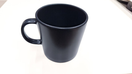 Empty ceramic gray mug on white background. dark grey tea cup isolated on white.