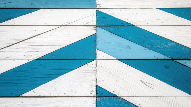 A geometric pattern of white and blue tiles on a wooden floor.